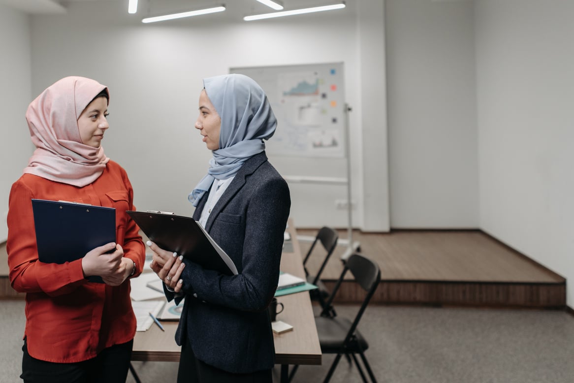 Women Wearing Hijab Having a Conversation at the Office