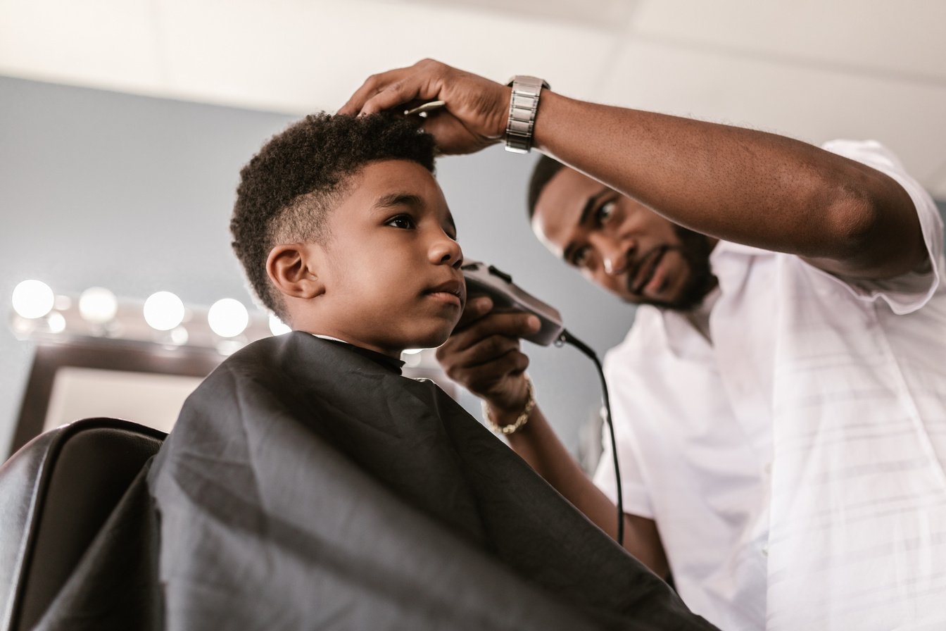 Man in White Dress Shirt Using Electric Razor