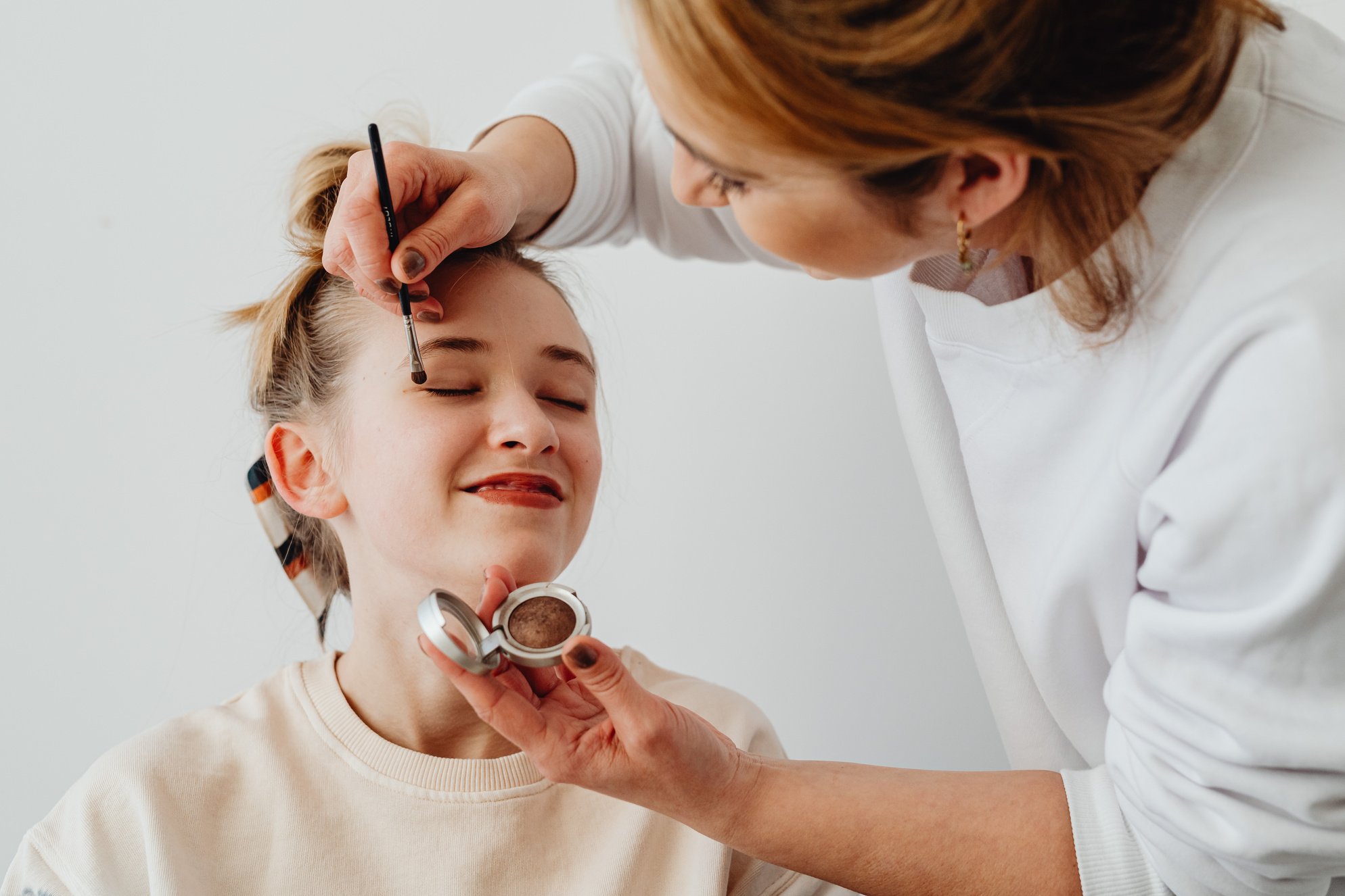 Woman Getting Her Make up Done