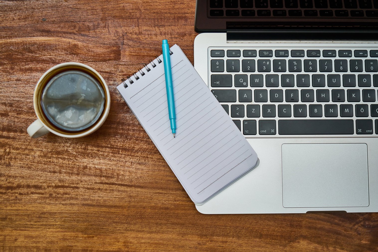 Coffee and a Laptop on a Wooden Table