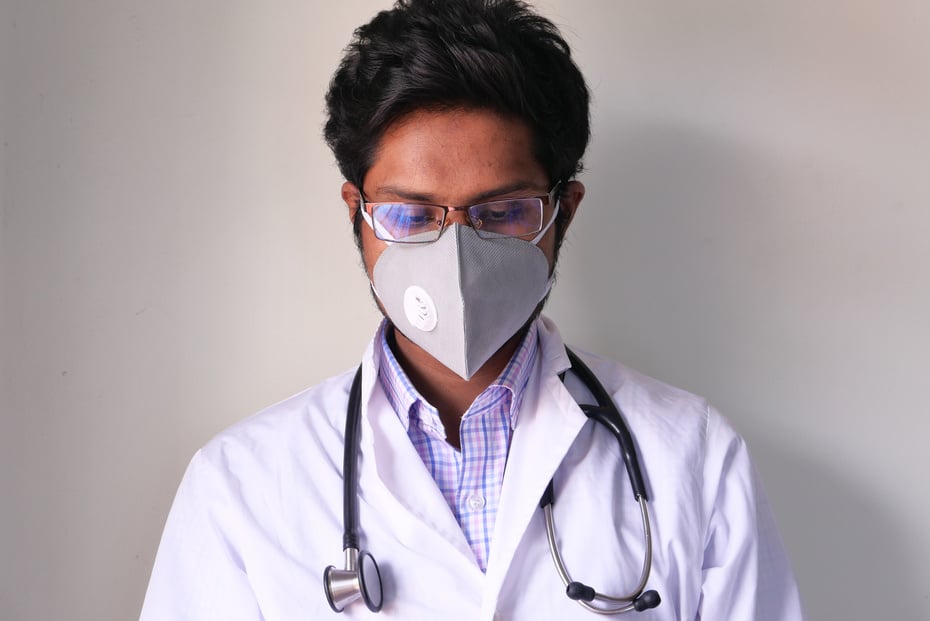 Doctor with Face Mask Looking down