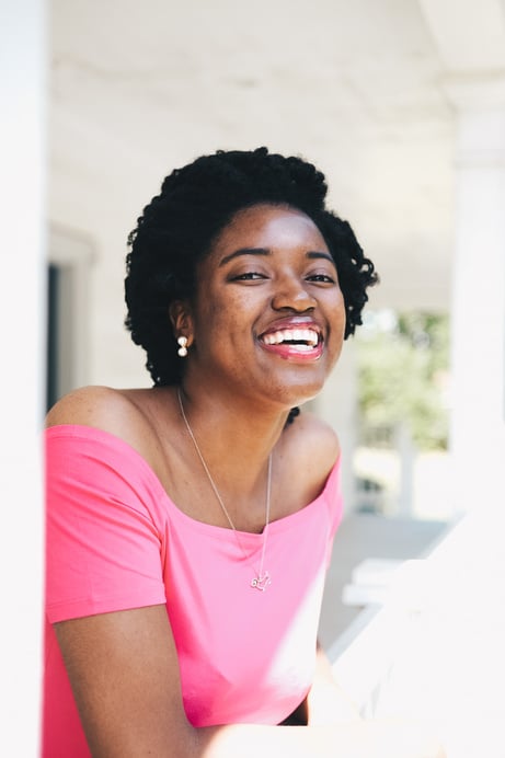 Smiling Woman Wearing Pink Off-shoulder Top