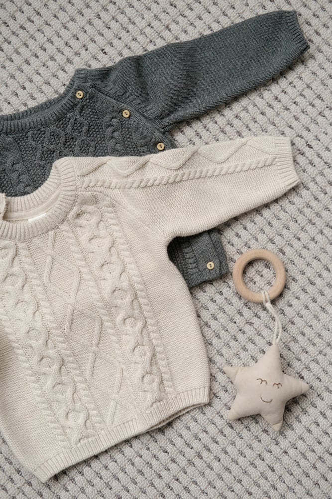 Baby Sweaters Laid Out