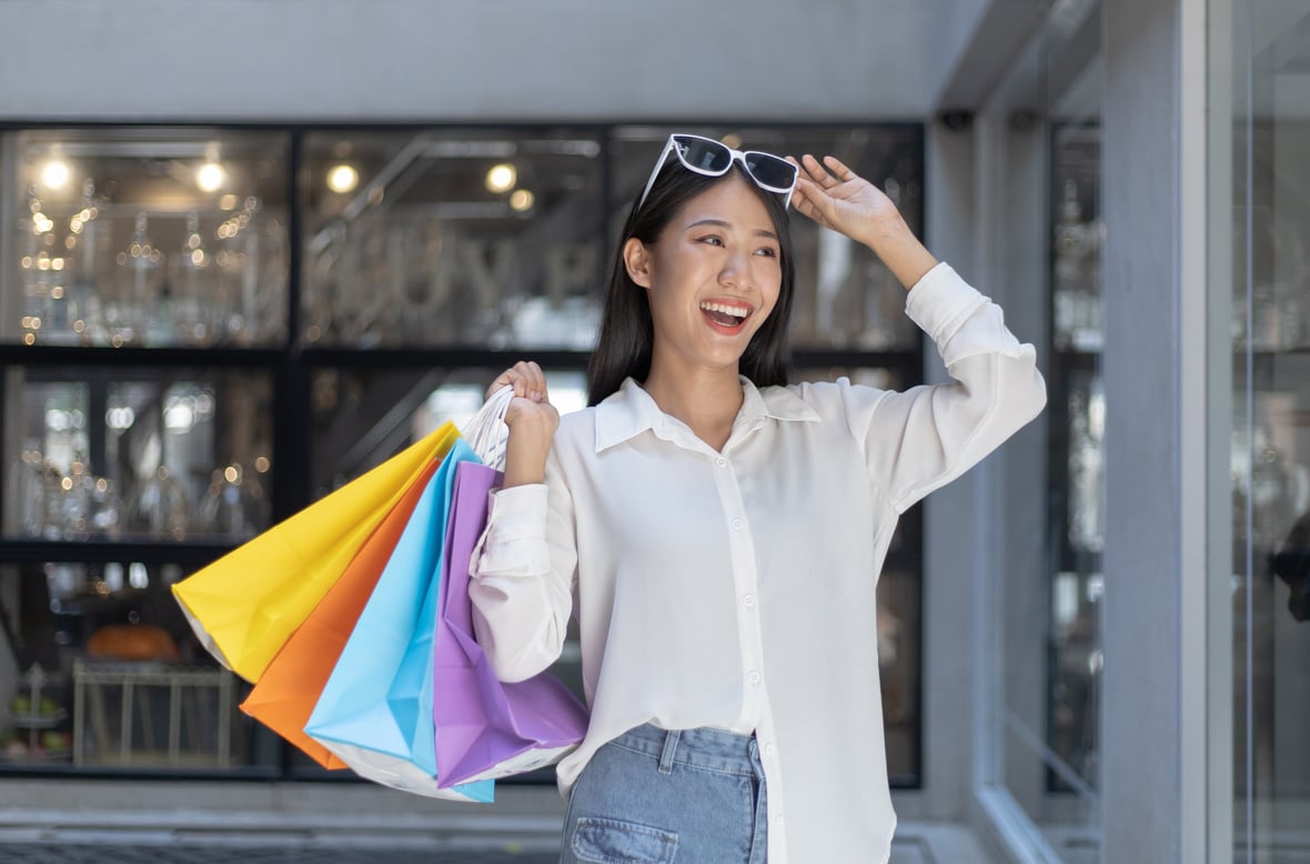 Happy Young Woman with Shopping Bags 