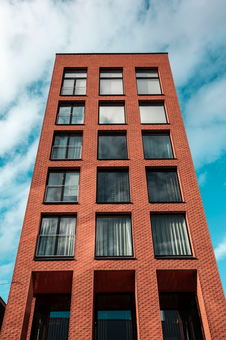 Red and Black Concrete High-rise Building